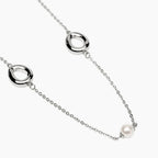 STYLE COLLECTION | STYLE 92  Collana in acciaio con catena rolò, elementi goccia e perle conchiglia