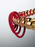 Bracciale Intreccio Tessuto Rosso Finitura in Oro - BRACCIALE