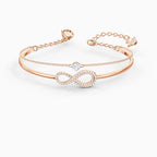 BRACCIALE RIGIDO SWAROVSKI INFINITY, BIANCO, PLACCATO COLOR ORO ROSA